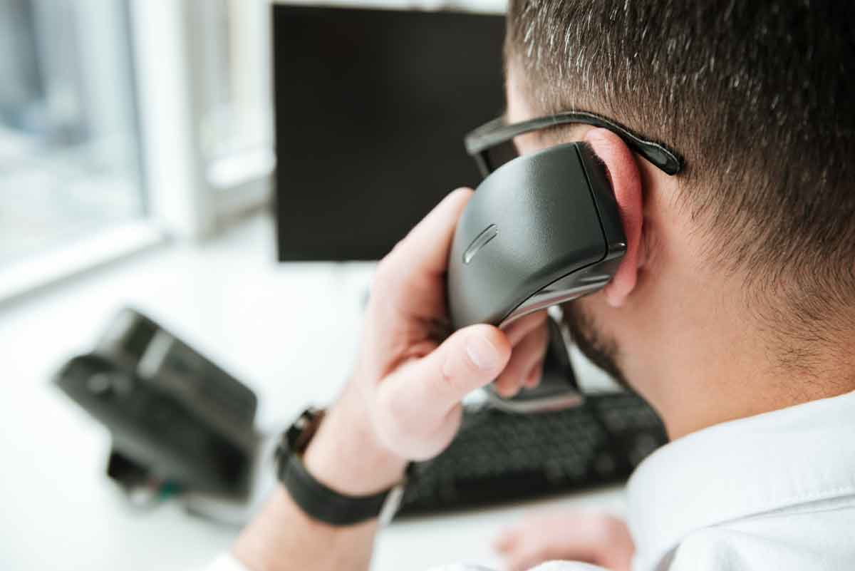 Back view of man talking on phone
