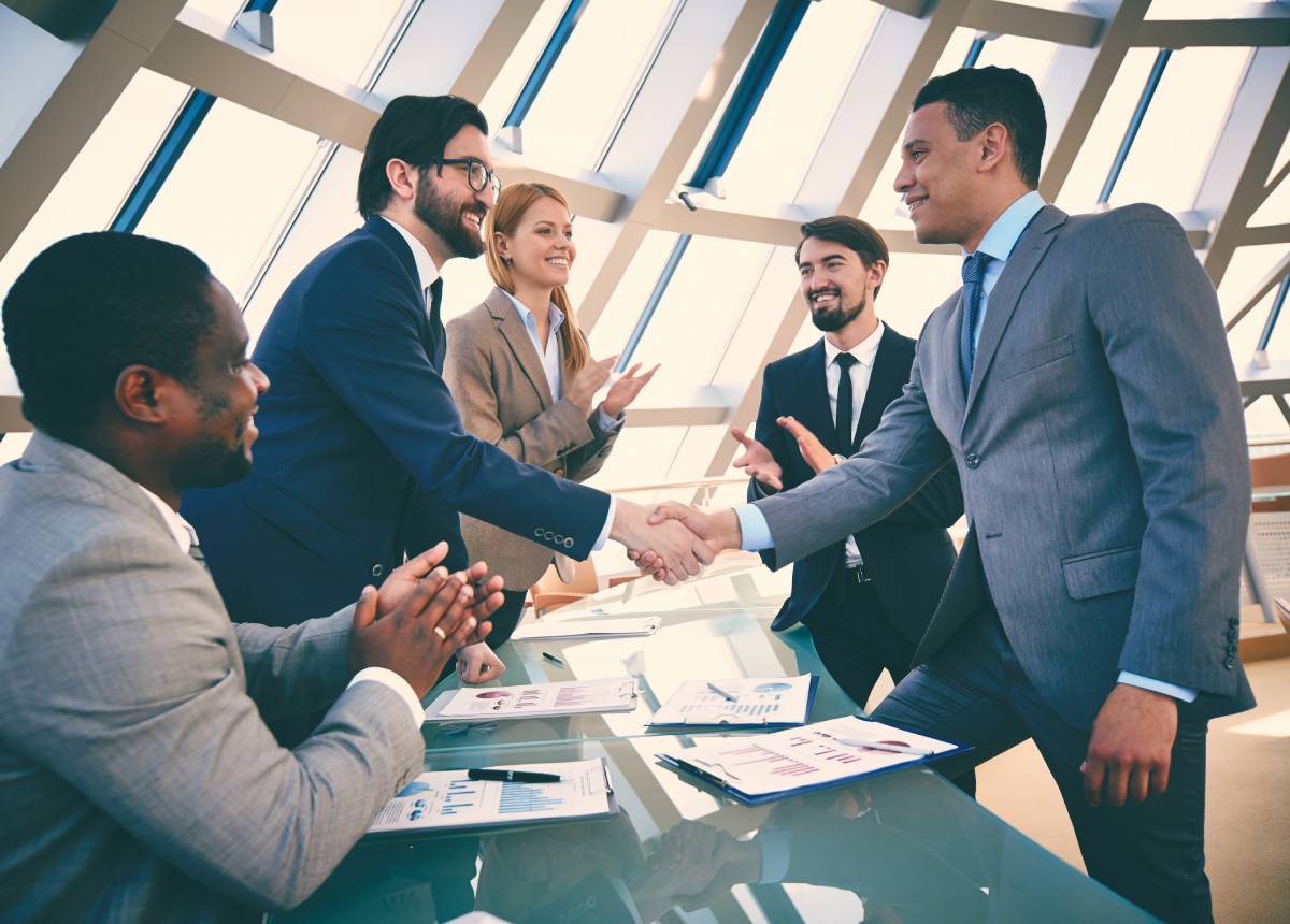 people standing and shaking hands