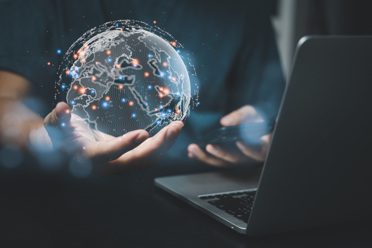 Man holding a world connection globe