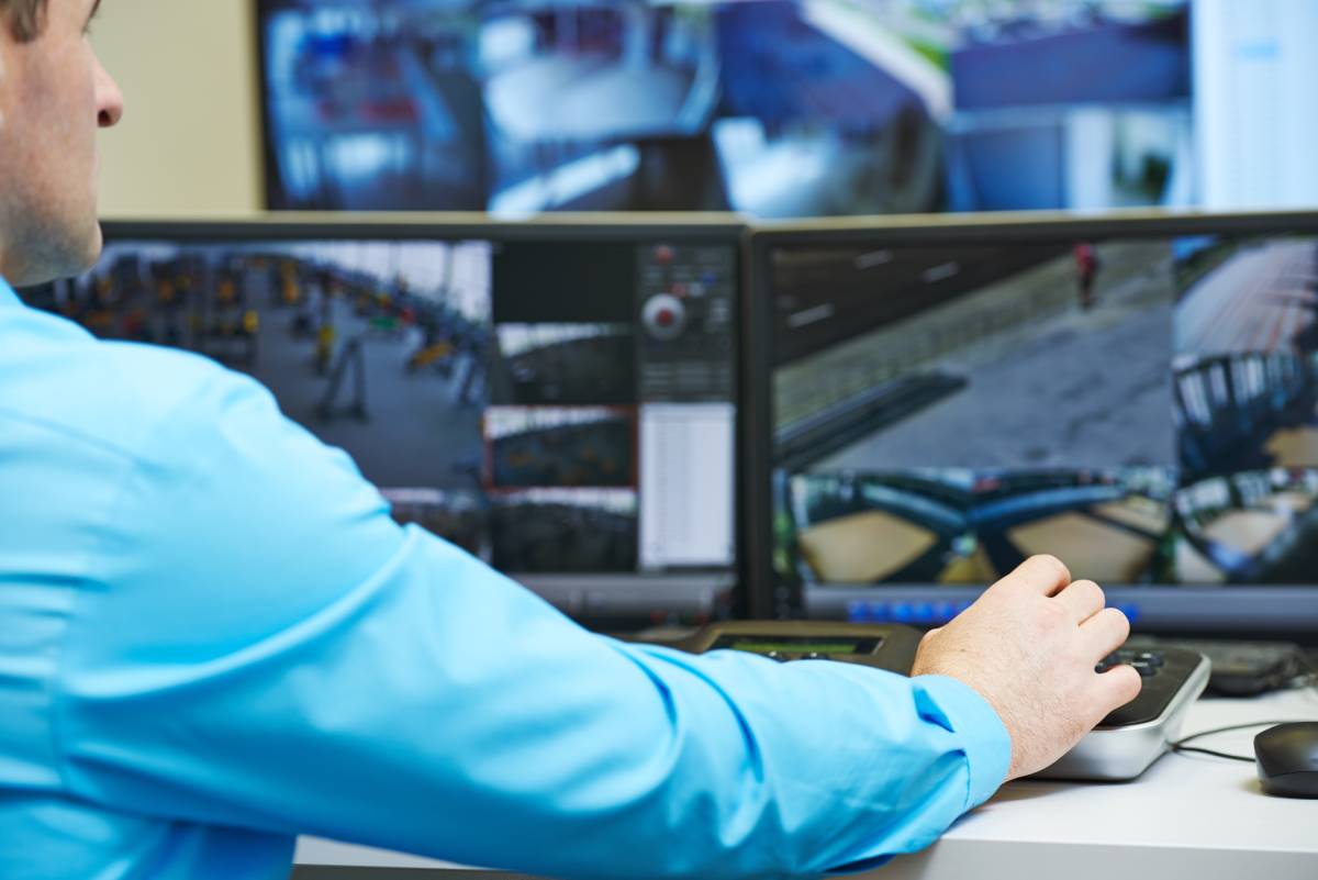 Man working at surveillance system room