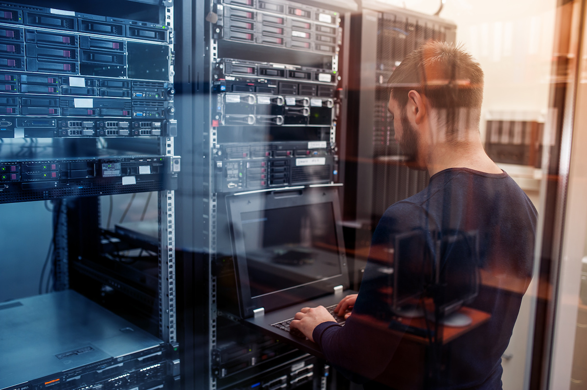 Man working in network server room