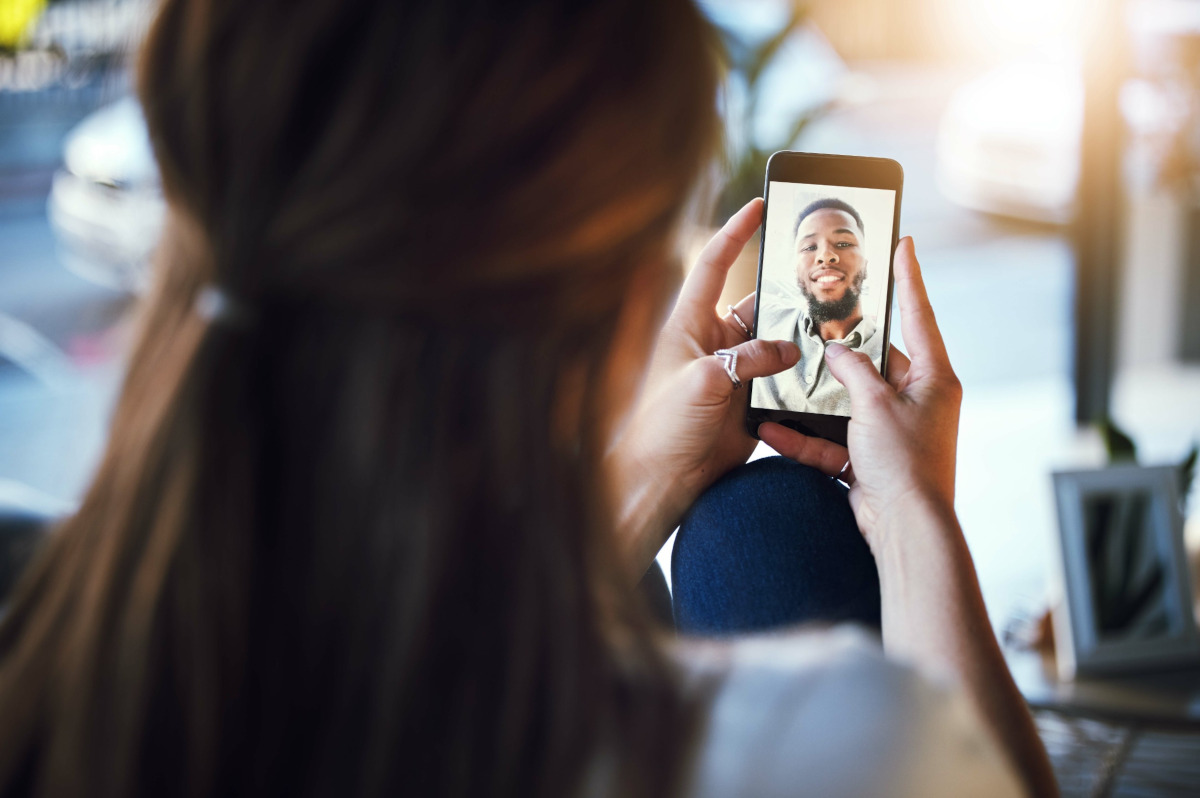 Man and woman talking on mobile phone via video chat